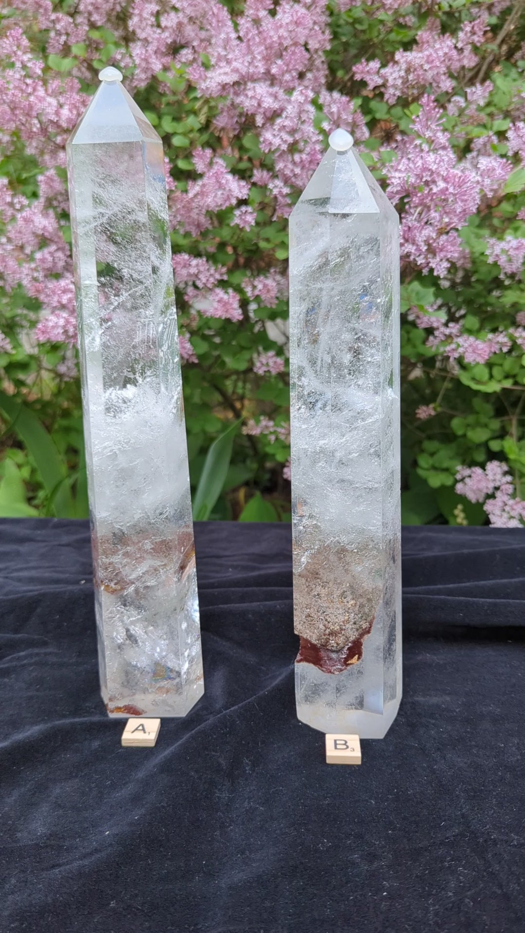 Video of XL Garden Quartz Towers A and B showing polished points, icy internal veils, earthy mineral inclusions, and outdoor scale views