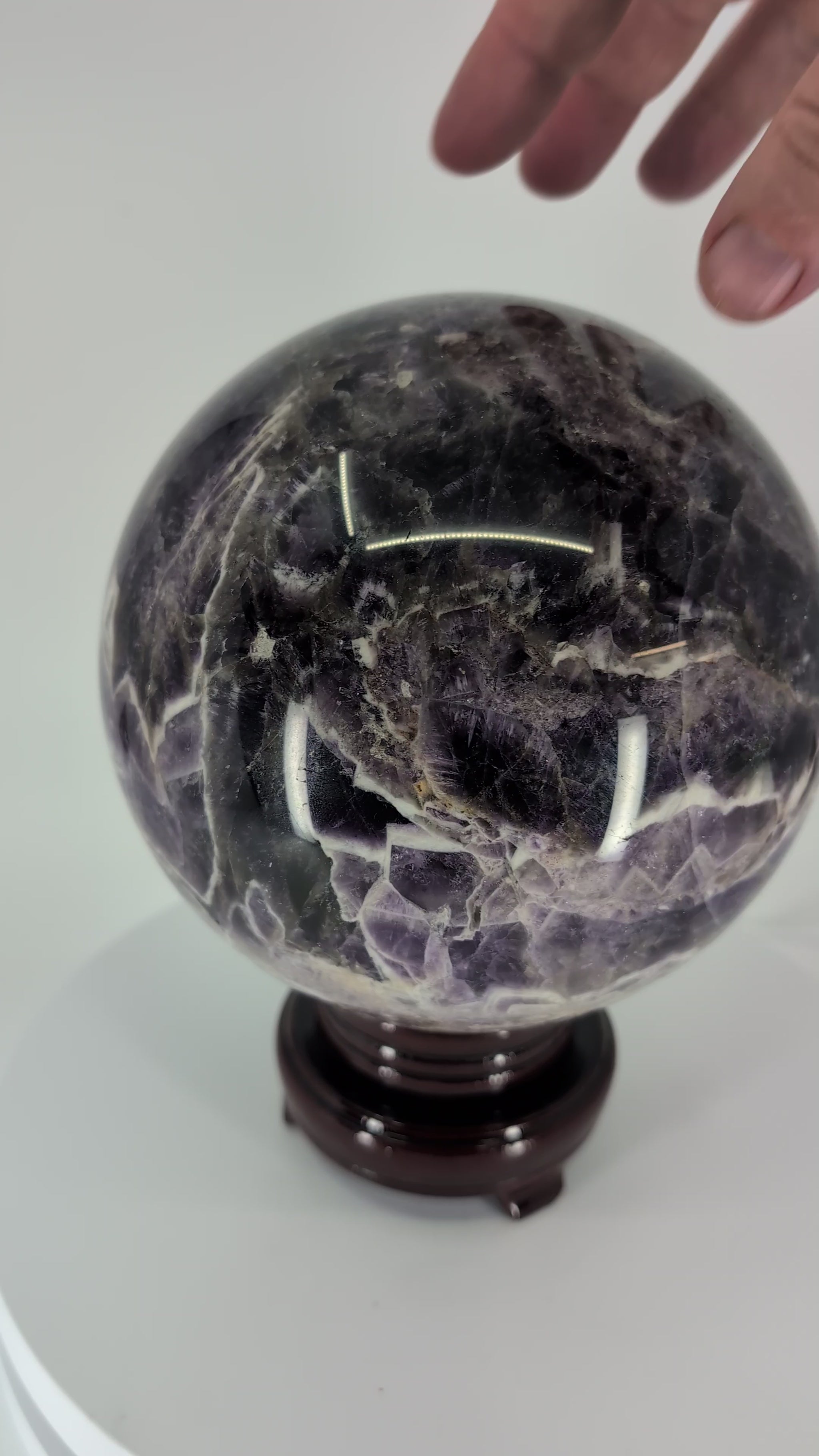 360° rotation video of Dream Amethyst sphere showing chevron pattern and polish