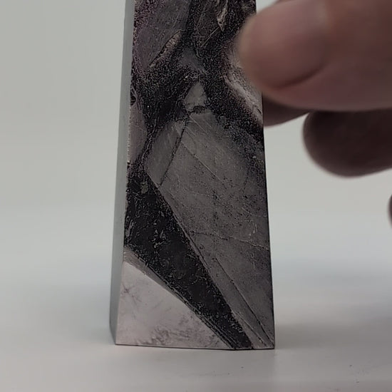 360° rotation video of polished Lepidolite tower from Minas Gerais showing lilac-grey mica zoning and sheen