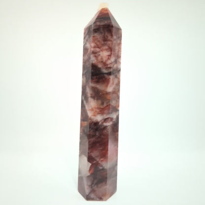 Video showcasing multiple Brazilian Fire Quartz towers in various sizes. Polished hematoid quartz points with fiery red hematite inclusions rotating under natural light.
