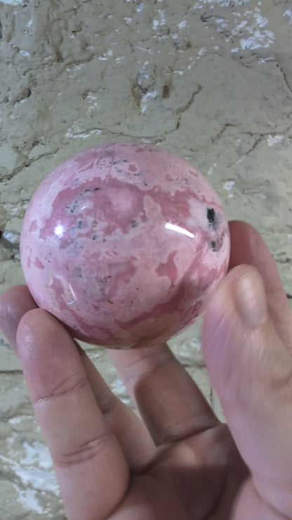 Pink Peruvian Rhodonite Sphere (E) – 68 mm / 550 g