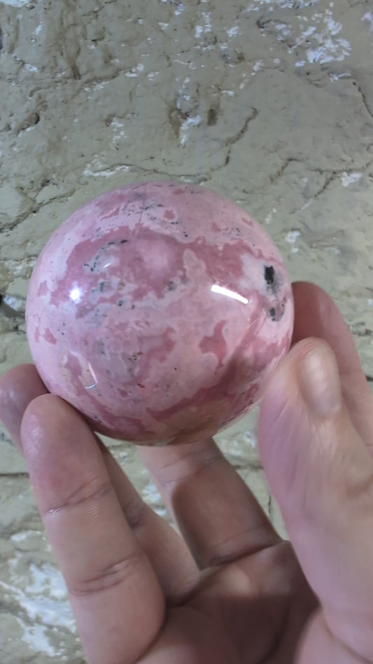 Pink Peruvian Rhodonite Sphere (E) – 68 mm / 550 g
