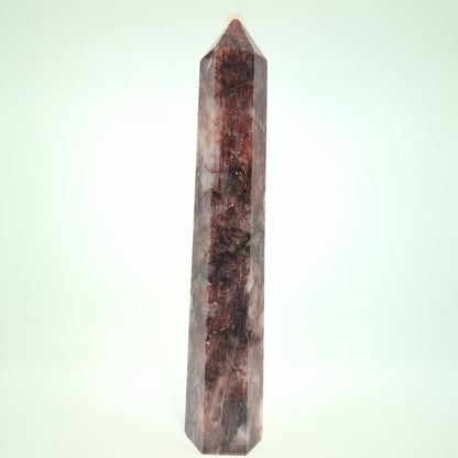 Video showcasing multiple Brazilian Fire Quartz towers in various sizes. Polished hematoid quartz points with fiery red hematite inclusions rotating under natural light.