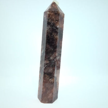 Video showcasing multiple Brazilian Fire Quartz towers in various sizes. Polished hematoid quartz points with fiery red hematite inclusions rotating under natural light.