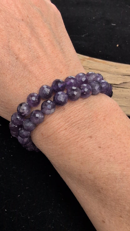 Video demonstrating the 8mm faceted Amethyst beaded stretch bracelet in motion, highlighting the light-catching geometric cuts and the deep purple colour saturation of the stones.