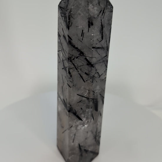 360° view of polished Black Tourmaline in Quartz tower from Brazil showing clarity and detailed inclusions.360° view of polished Black Tourmaline in Quartz tower from Brazil showing clarity and detailed inclusions.