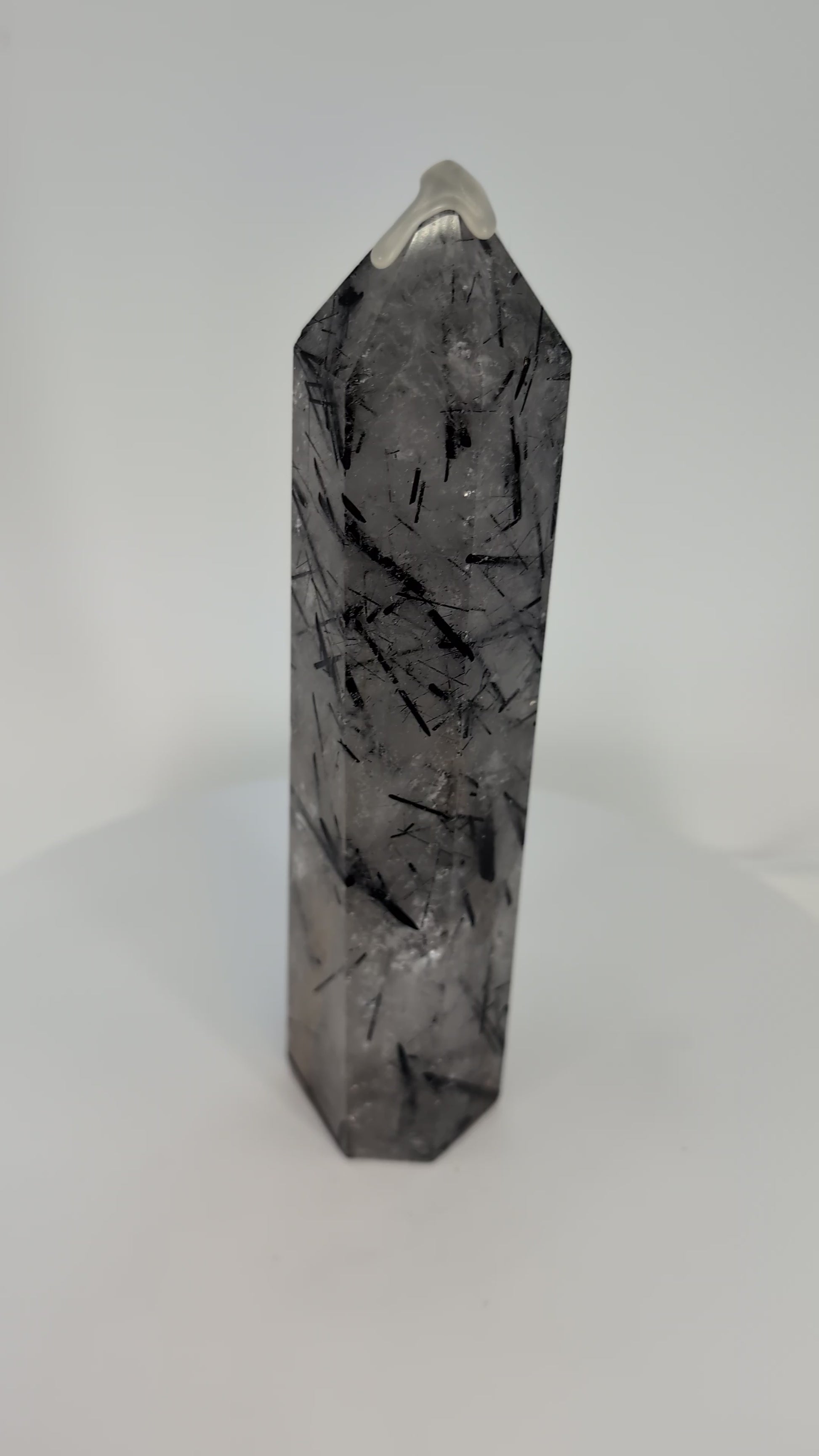 360° view of polished Black Tourmaline in Quartz tower from Brazil showing clarity and detailed inclusions.360° view of polished Black Tourmaline in Quartz tower from Brazil showing clarity and detailed inclusions.