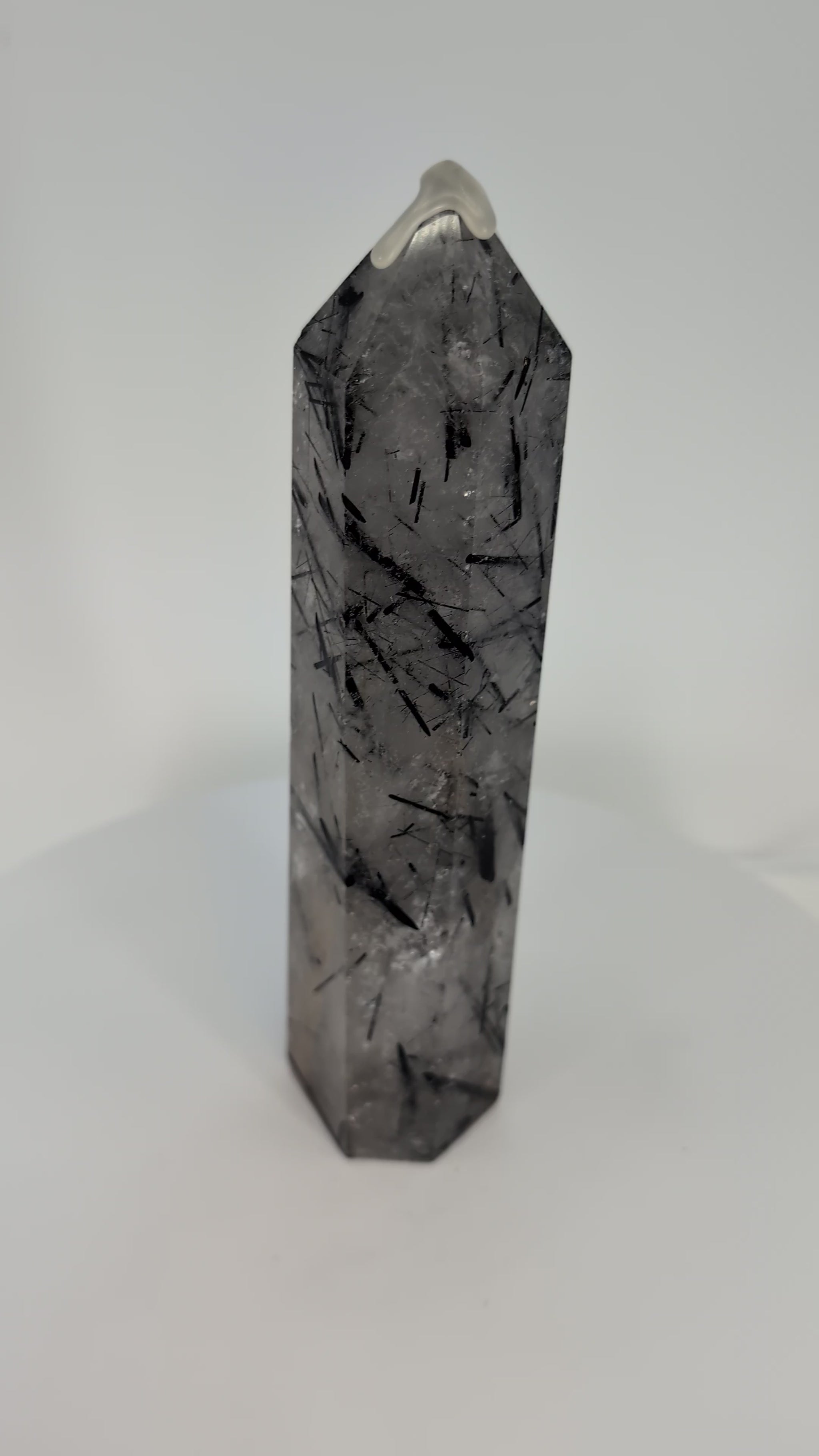 360° view of polished Black Tourmaline in Quartz tower from Brazil showing clarity and detailed inclusions.360° view of polished Black Tourmaline in Quartz tower from Brazil showing clarity and detailed inclusions.
