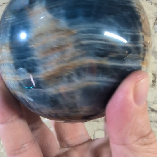 360° video of polished blue onyx sphere with concentric veining