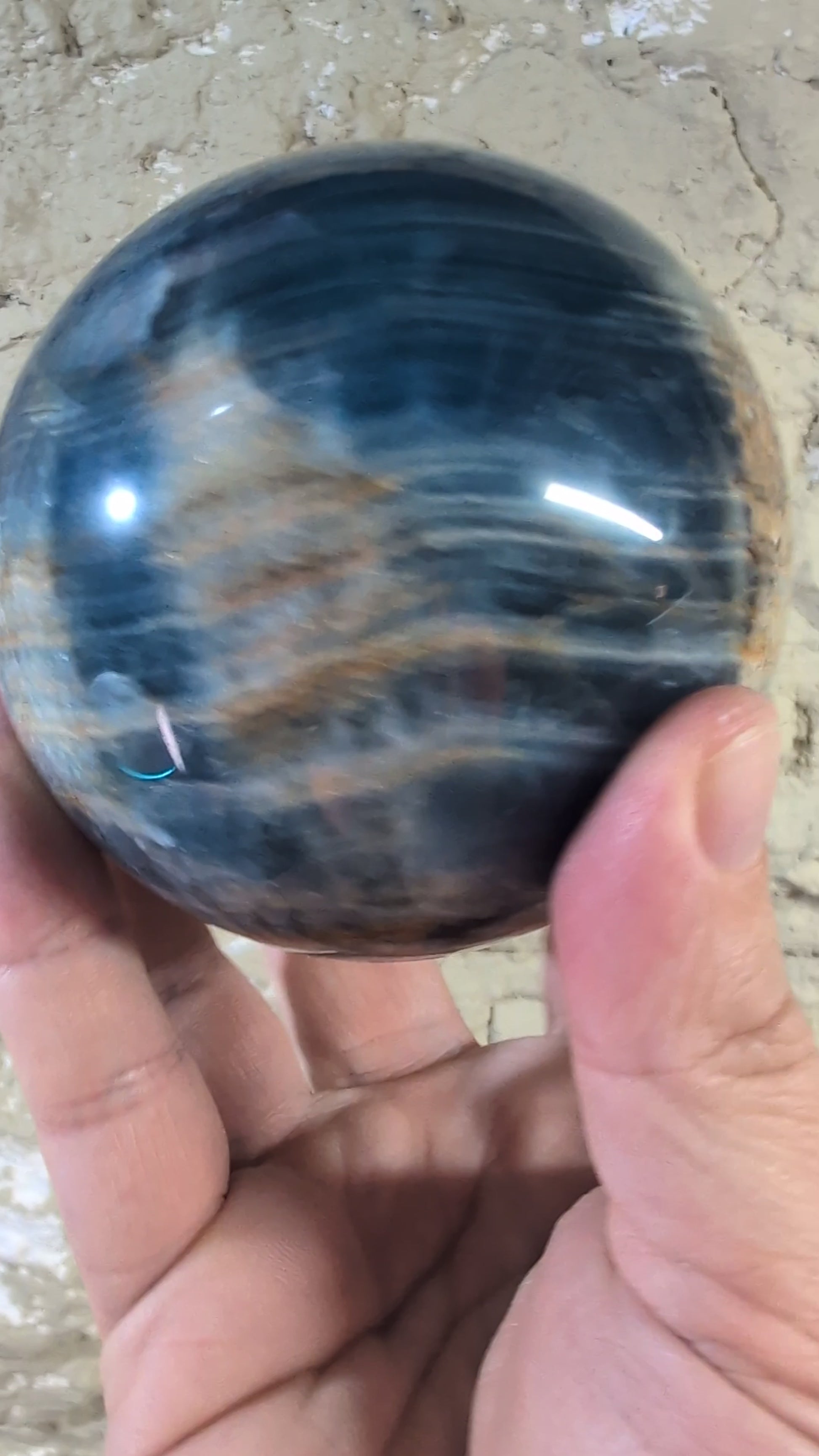 360° video of polished blue onyx sphere with concentric veining