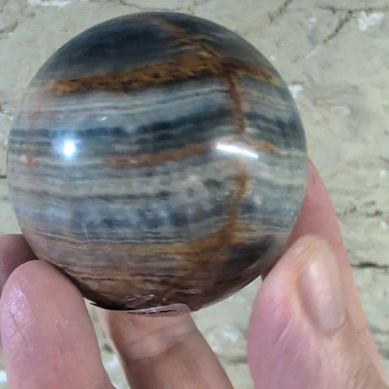 360° rotation video of 60mm Blue Onyx Sphere with banding detail