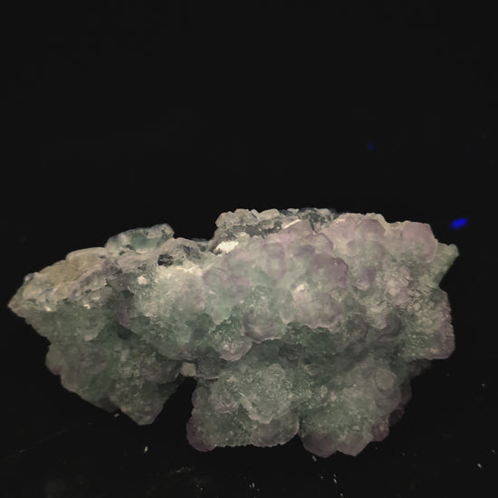 UV light test showing blue-violet fluorescence in fluorite and no fluorescence in white calcite on Zhejiang specimen