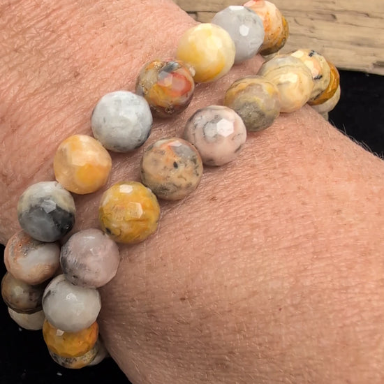 Video demonstrating the 8mm faceted Crazy Lace Agate beaded stretch bracelet in motion, highlighting the light-catching geometric cuts and the complex, multi-coloured natural banding and lace patterns across the stones.