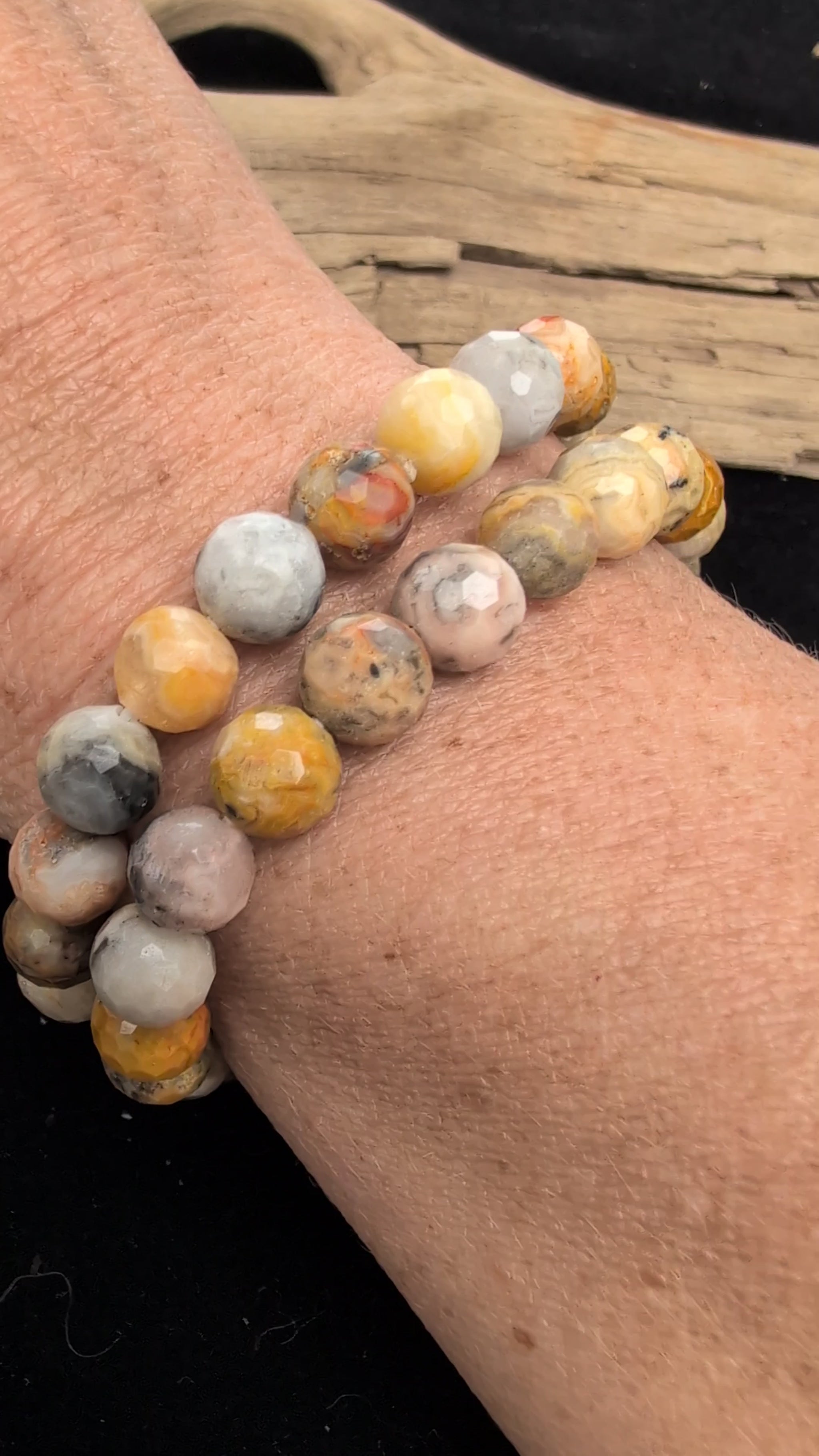 Video demonstrating the 8mm faceted Crazy Lace Agate beaded stretch bracelet in motion, highlighting the light-catching geometric cuts and the complex, multi-coloured natural banding and lace patterns across the stones.