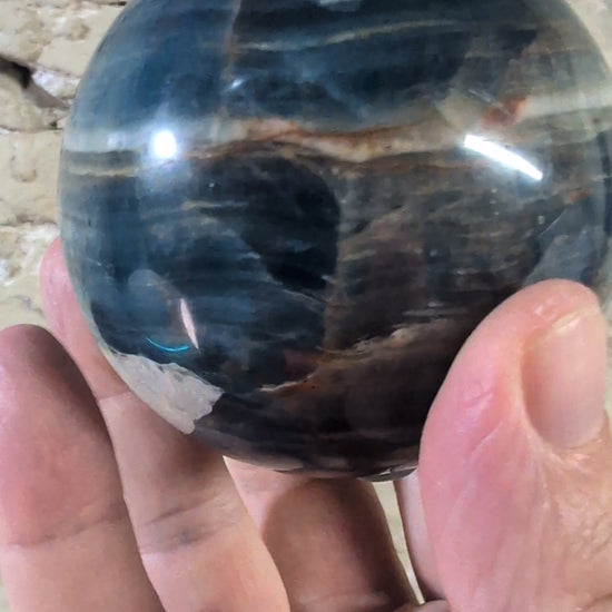 360° video of polished blue onyx sphere with mixed finish and white band