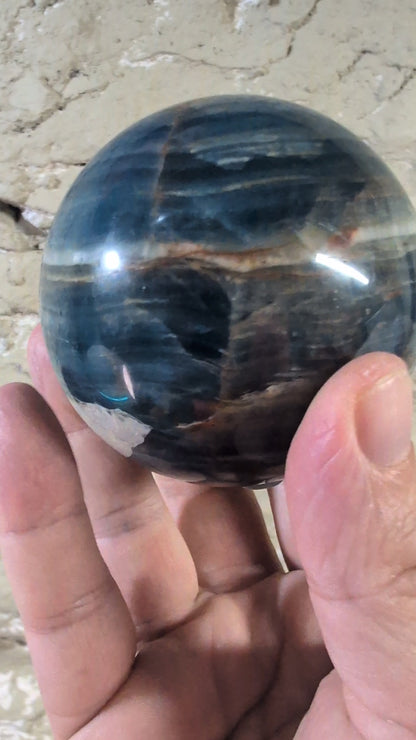 360° video of polished blue onyx sphere with mixed finish and white band