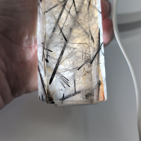 Black Tourmaline in Quartz tower illuminated from behind, revealing fine tourmaline needles and exceptional transparency.