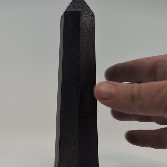 Balanced 410g Shungite tower video showing clean edges, reflective finish, and symmetrical proportions.