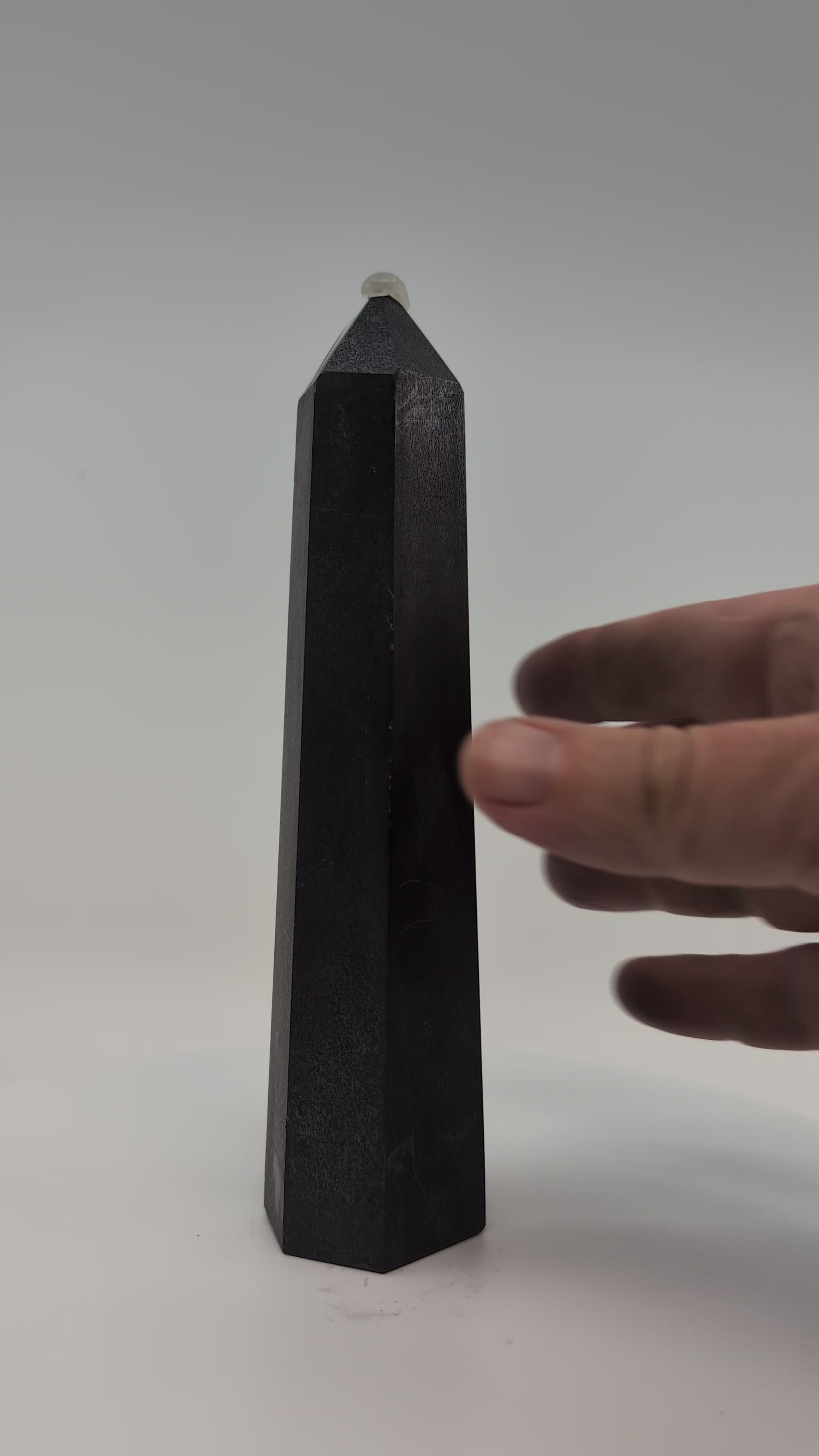 Balanced 410g Shungite tower video showing clean edges, reflective finish, and symmetrical proportions.