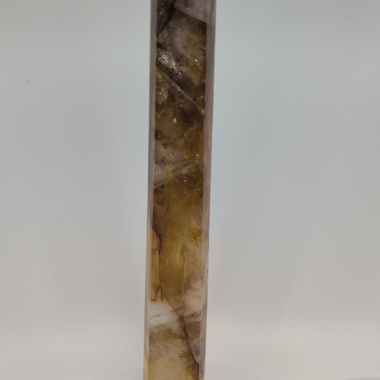 Golden Healer Quartz Tower 1.02 kg from Brazil rotating under natural light, showing golden zoning and sharp polished termination.