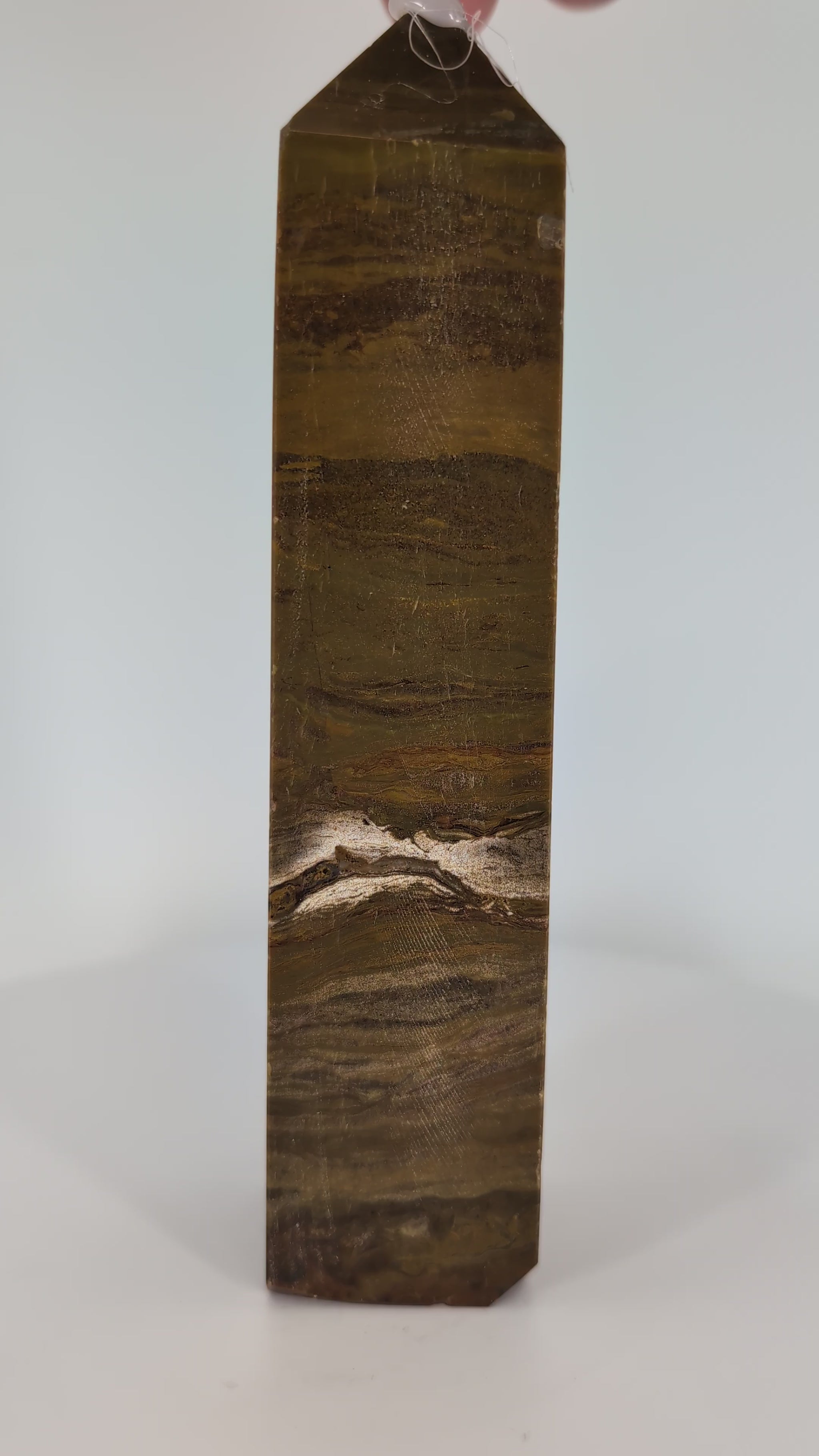 Ocean Jasper Tower OJ-03 video – 16 cm, 425 g, deep red-brown banded jasper. Vertical rotation highlighting concentric banding and high-gloss polish.