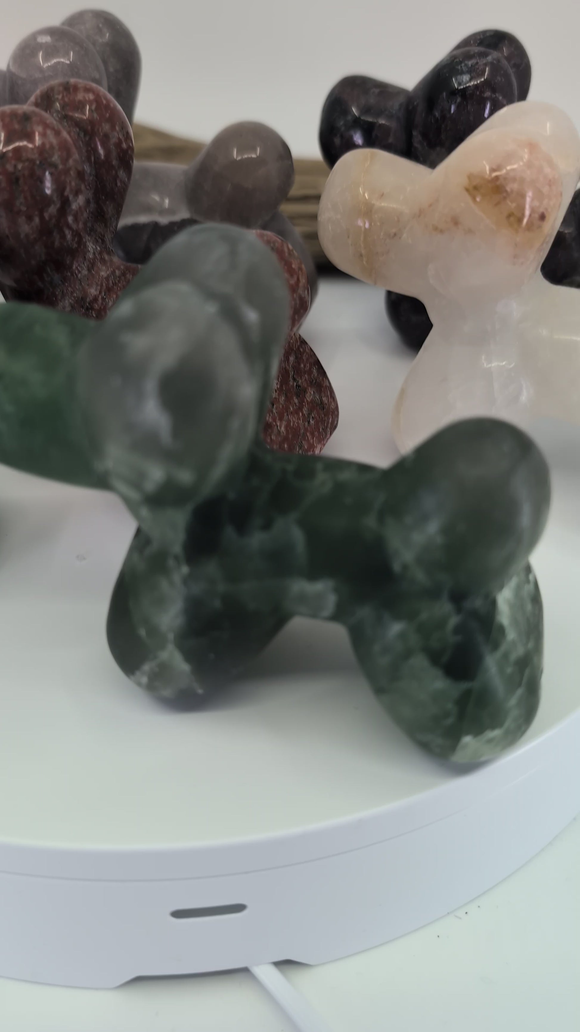 360-degree pan of the complete Balloon Dog collection featuring hand-carved specimens in Pyrite, Yooperlite, Green Fluorite, Rose Quartz, and Garnet in Matrix.