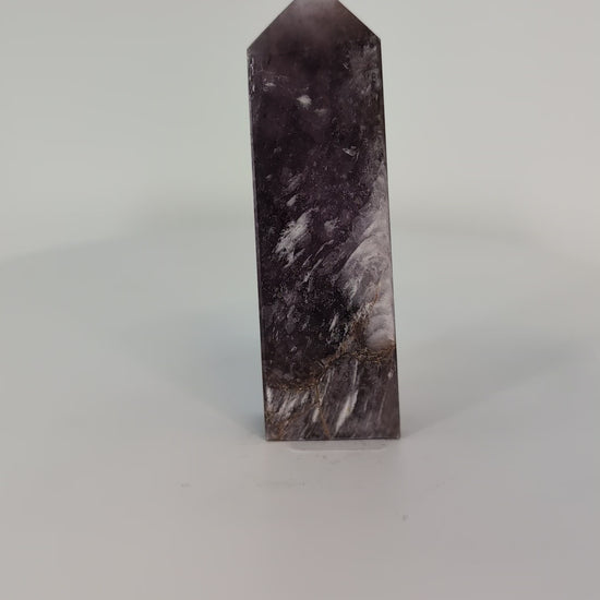 Rotating video of Purple Mica Tower from Madagascar – hand-polished crystal shimmering with purple and silver reflections.