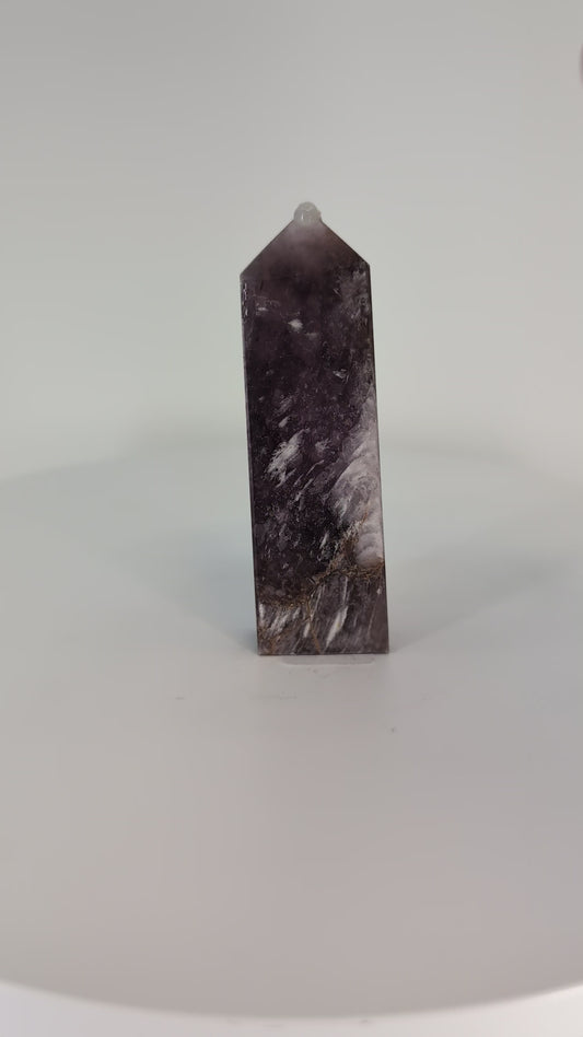 Rotating video of Purple Mica Tower from Madagascar – hand-polished crystal shimmering with purple and silver reflections.