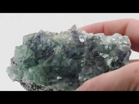 Rotating video showcase of 430g Blue-Green Fluorite cluster from Zhejiang on granular matrix, showing stacked cubic habit and watery translucence.