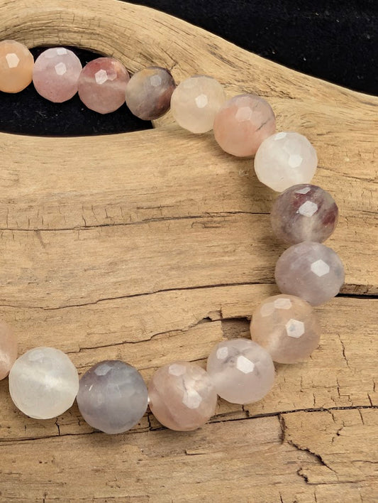 Macro close-up of 8mm faceted Purple Aventurine beads highlighting the geometric cut and subtle natural aventurescence.