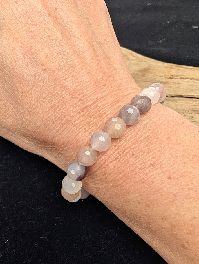 8mm faceted Purple Aventurine beaded stretch bracelet worn on a wrist for size scale.