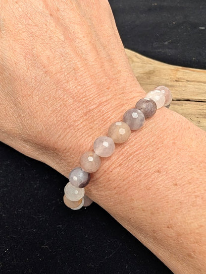 8mm faceted Purple Aventurine beaded stretch bracelet worn on a wrist for size scale.