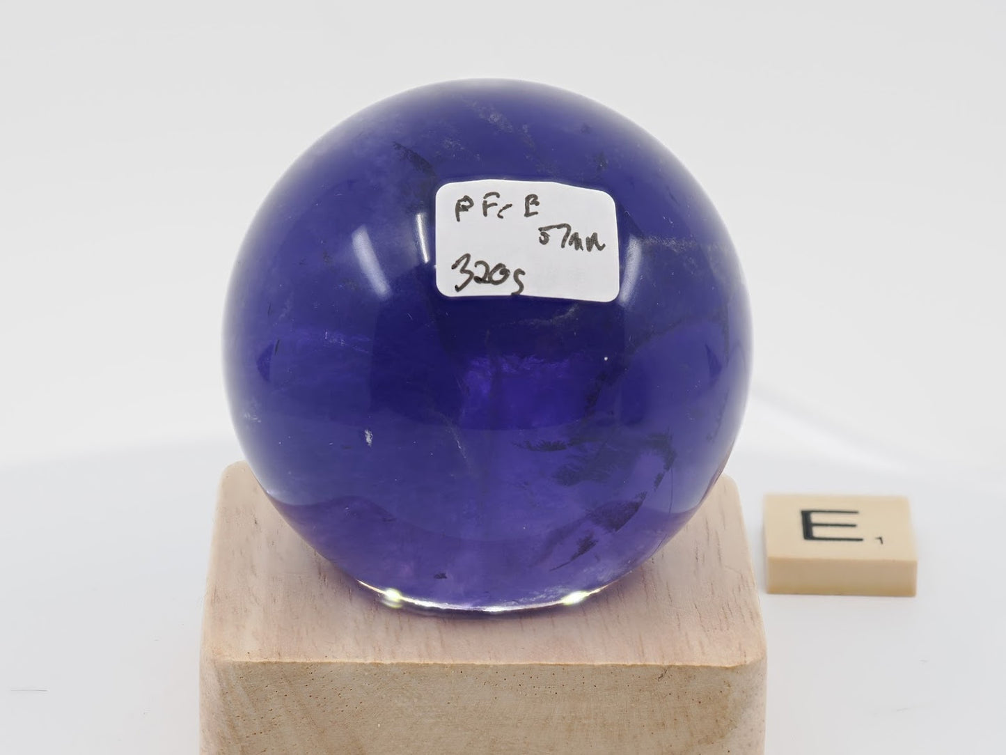 57mm midnight Purple Fluorite sphere labeled PF-E with 320g weight and nebula inclusions.
