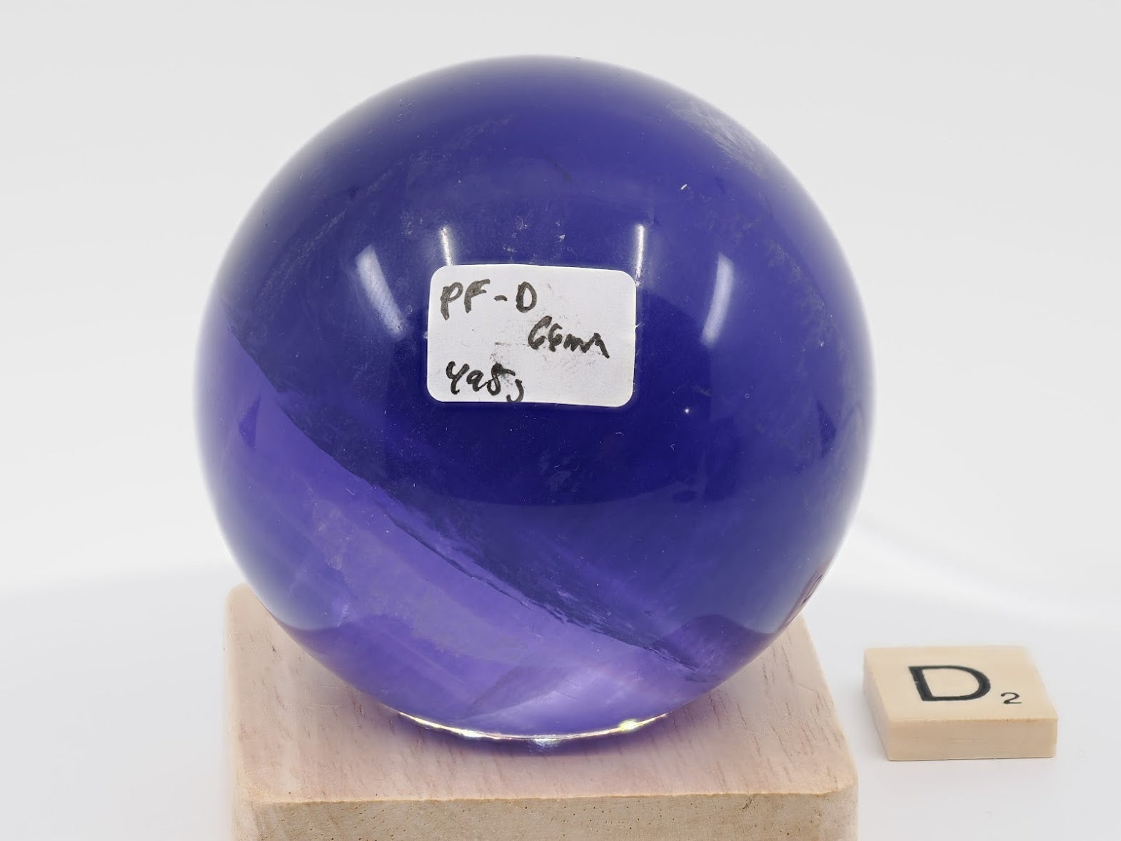 66mm high-mass Purple Fluorite sphere labeled PF-D with 498g weight and horizon line.