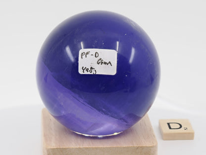 66mm high-mass Purple Fluorite sphere labeled PF-D with 498g weight and horizon line.