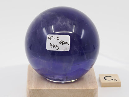 Largest 69mm Purple Fluorite sphere labeled PF-C with 450g weight and phantom chevrons.