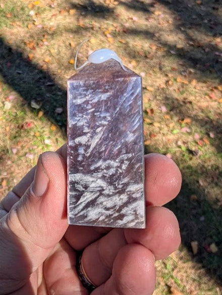 Purple Lepidolite Mica Tower from Brazil (#5) in hand, showing size and natural shine