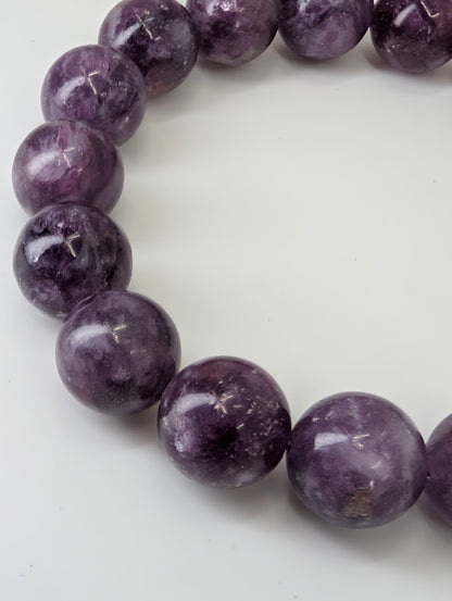 Detailed view of Purple Mica beads with layered mica inclusions