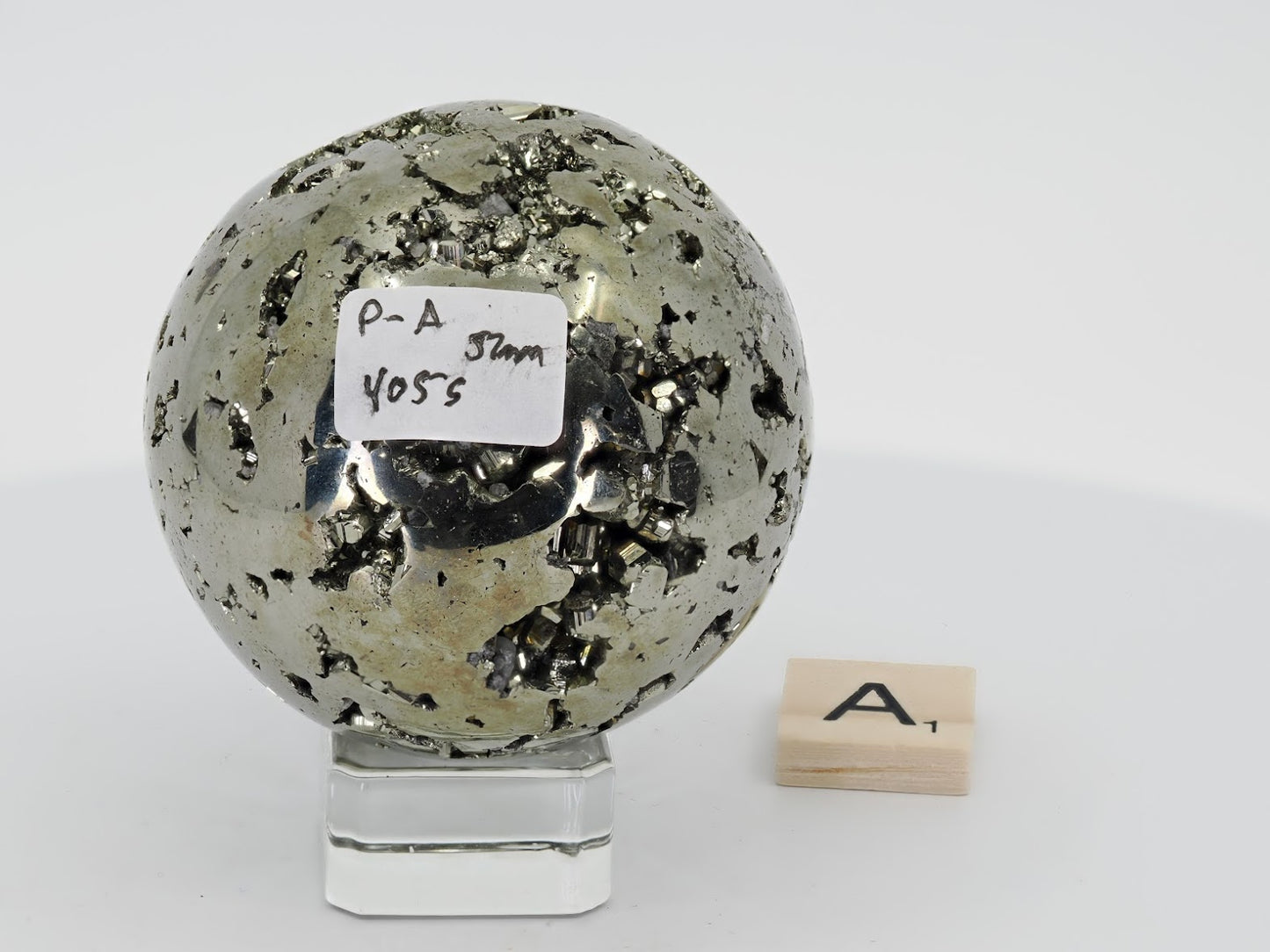 Peruvian Pyrite sphere Specimen A with label showing 405g weight and 52mm diameter.