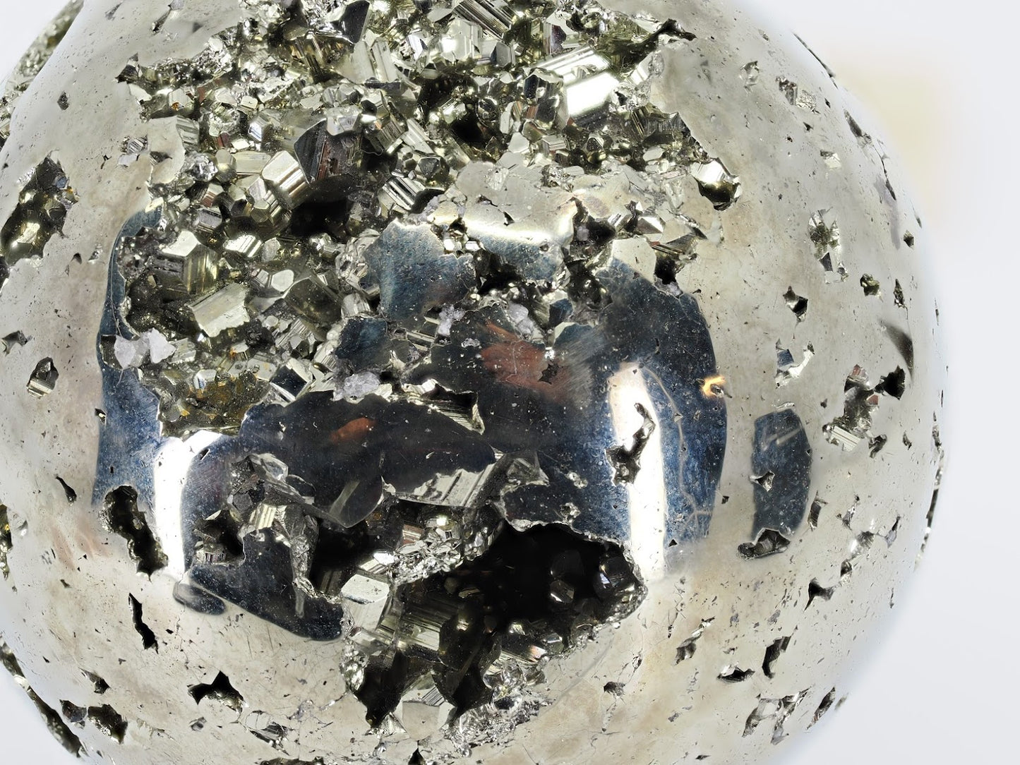 Macro detail of sharp cubic pyrite crystals inside the natural cavity of sphere A.