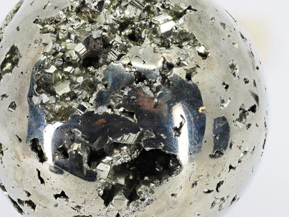 Macro detail of sharp cubic pyrite crystals inside the natural cavity of sphere A.