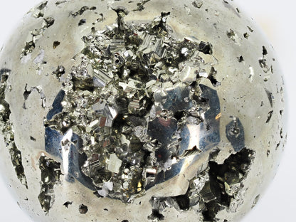Deep look into the crystal-lined cave of Pyrite sphere A showing metallic luster.