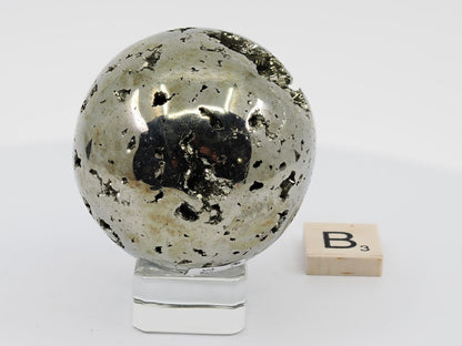 Surface texture and metallic shine of Peruvian Pyrite sphere B showing natural iron sulfide formation.