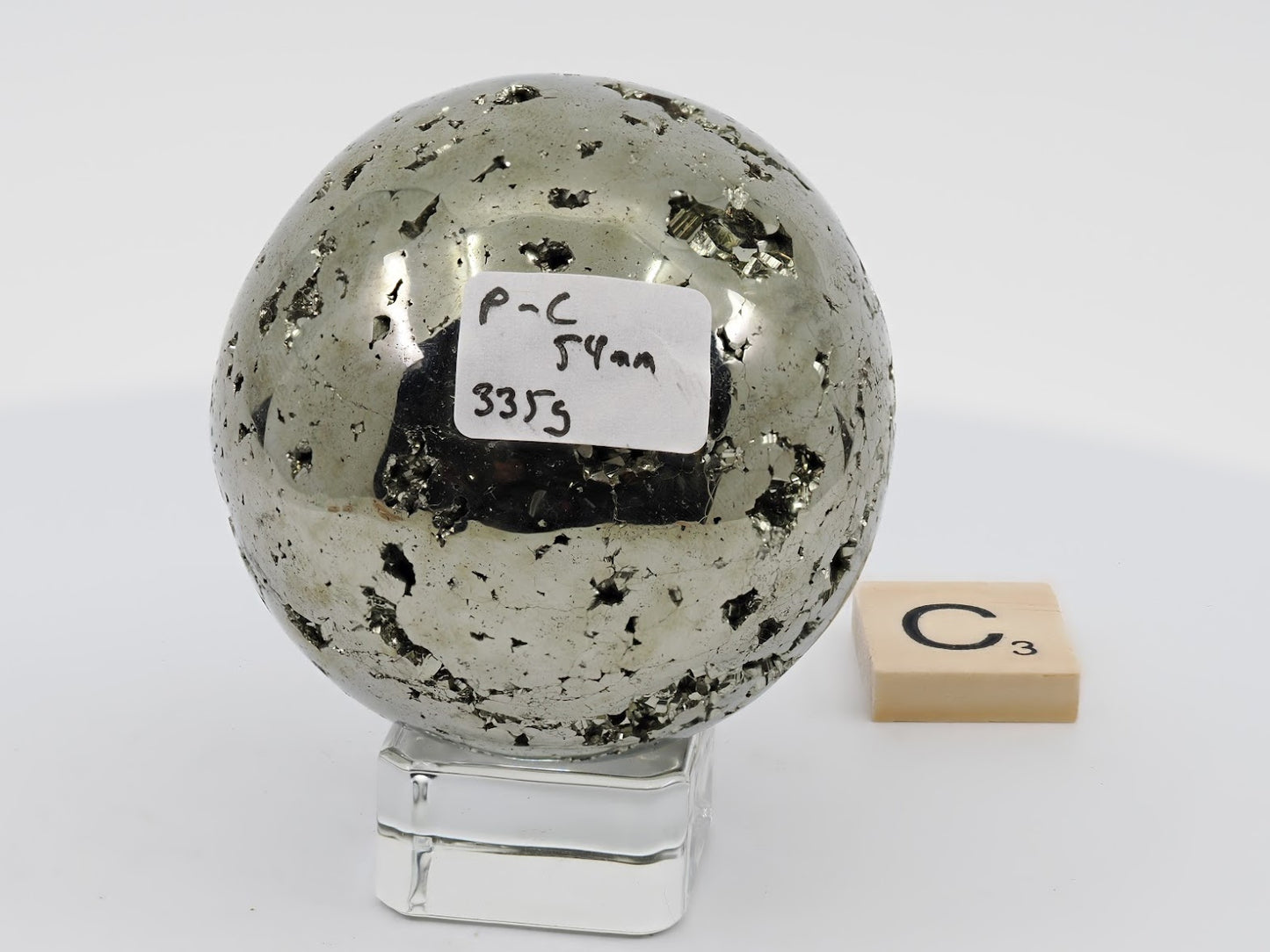 Peruvian Pyrite sphere Specimen C (335g) featuring high-luster polish and central vug.