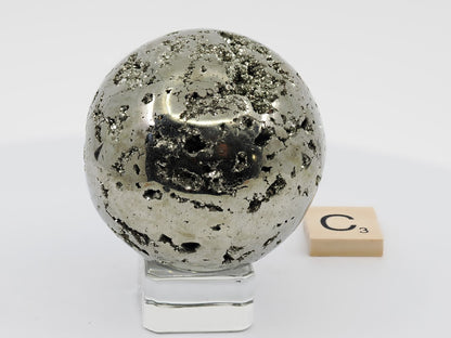 Close up of metallic texture and deep crystal vugs on Pyrite sphere C.