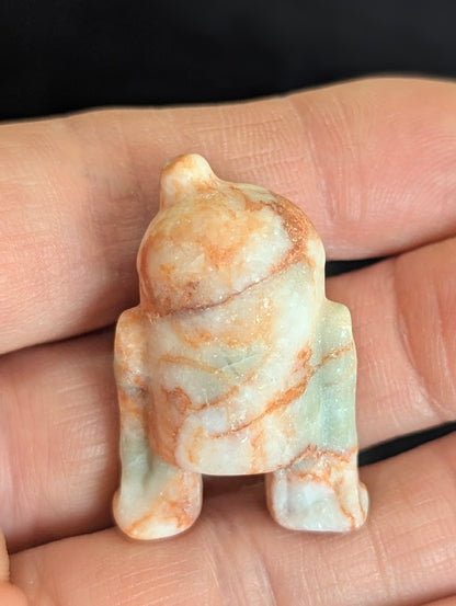 Rear view of a pink and white Jasper R2-D2 showing precision-carved astromech details.