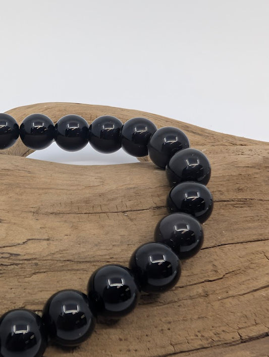 Closeup showing polished beads and subtle iridescent rainbow sheen