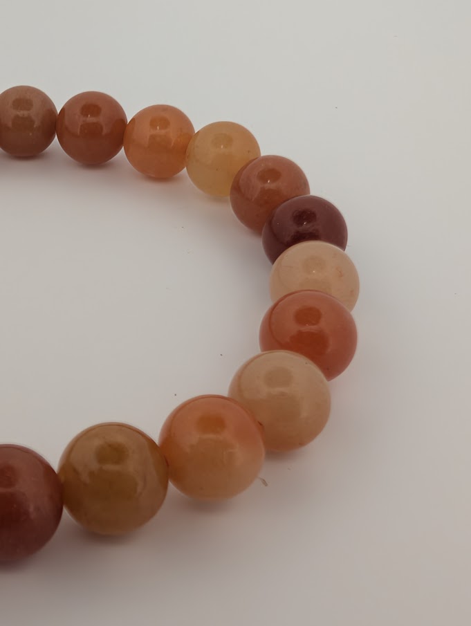 8mm red aventurine bracelet closeup highlighting deep orange beads