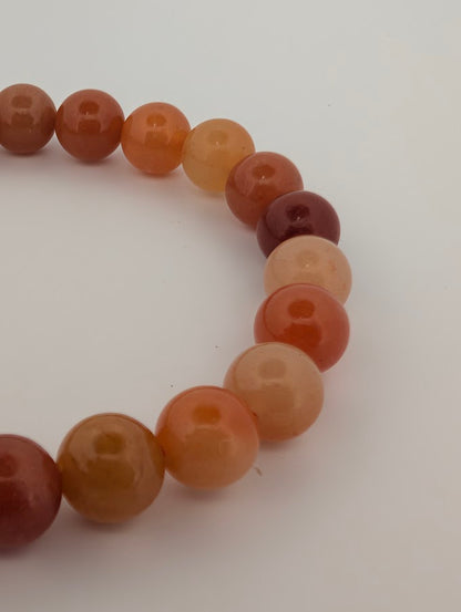 8mm red aventurine bracelet closeup highlighting deep orange beads