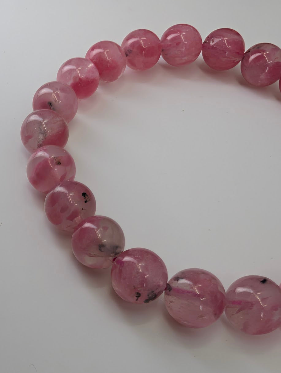 Rhodonite bracelet from Madagascar featuring 9 millimeter quartz-hosted pink beads